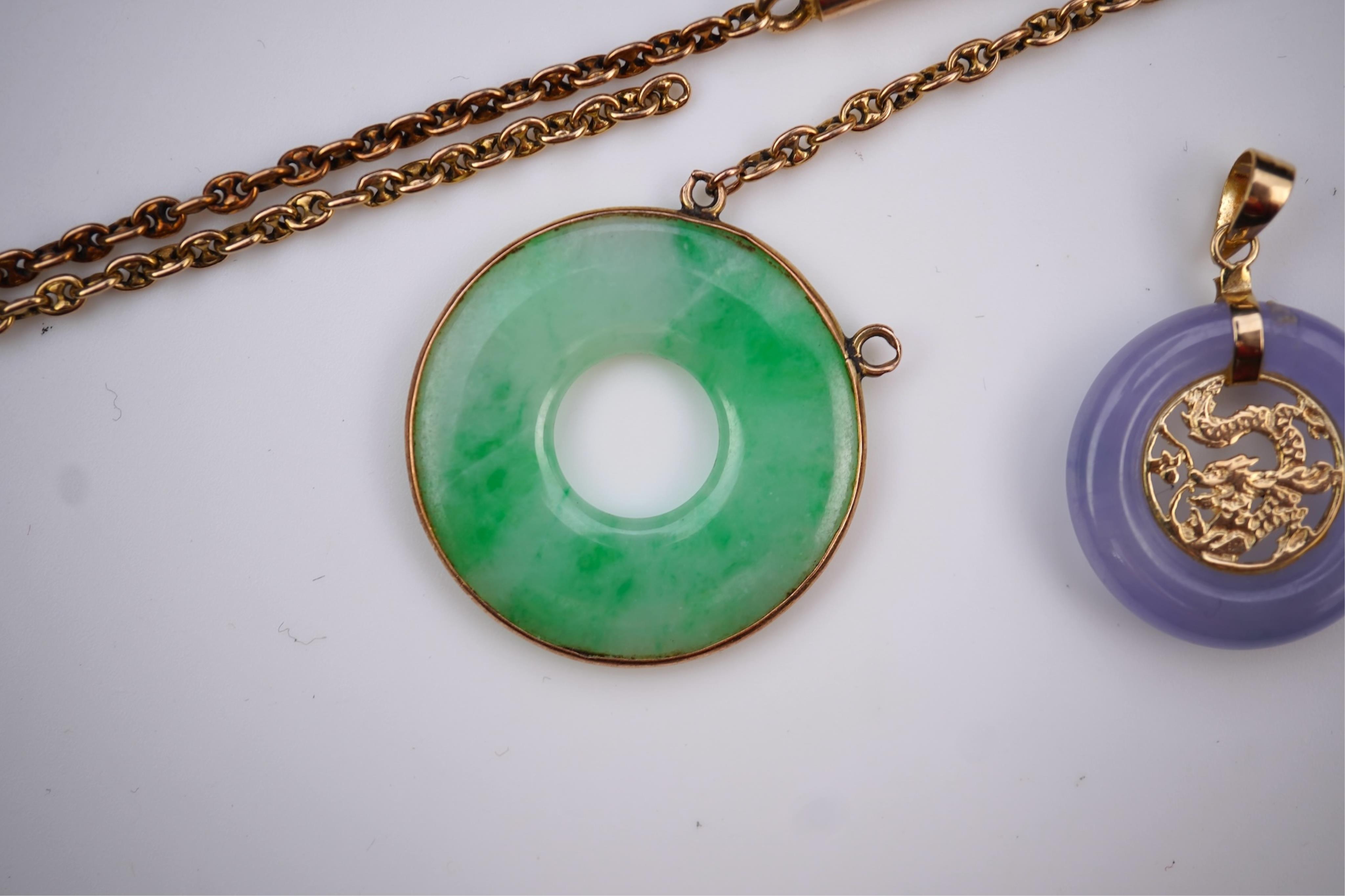 Two jadeite pendants